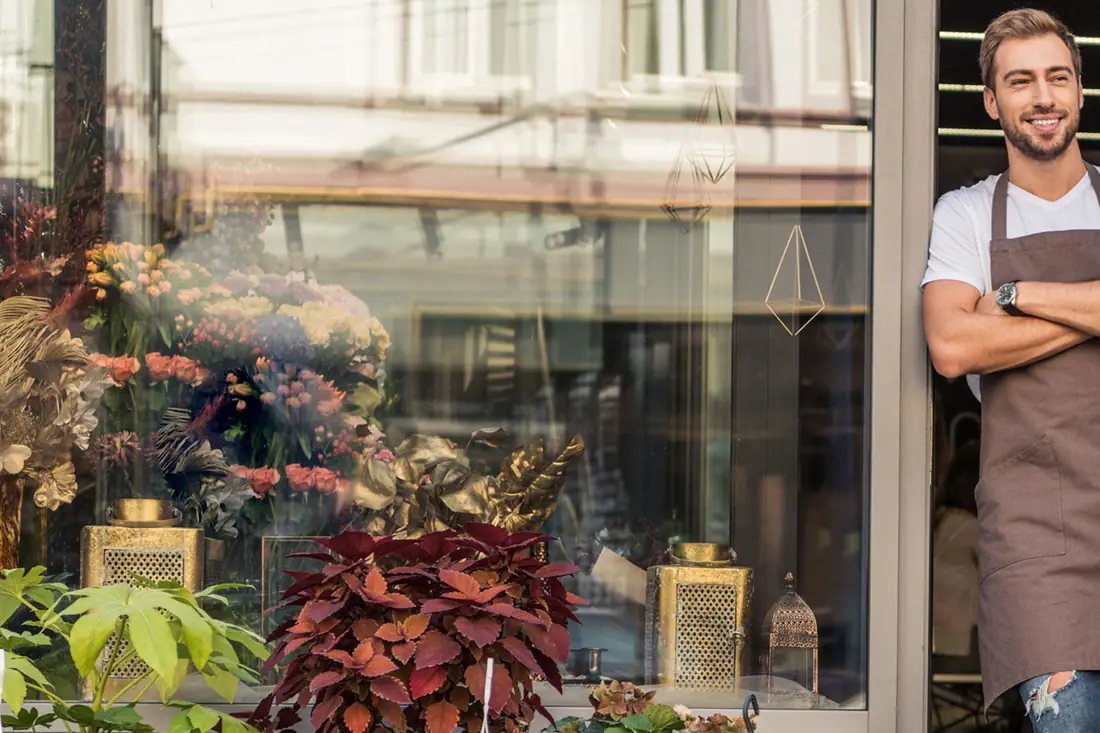 A florist outside her shop.